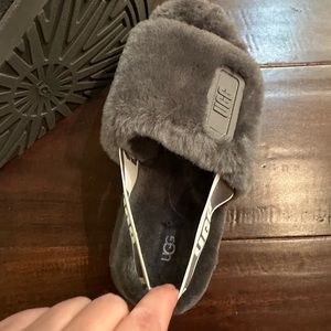 Woman's UGG fur slides, size 7, new but no tags. Gray color